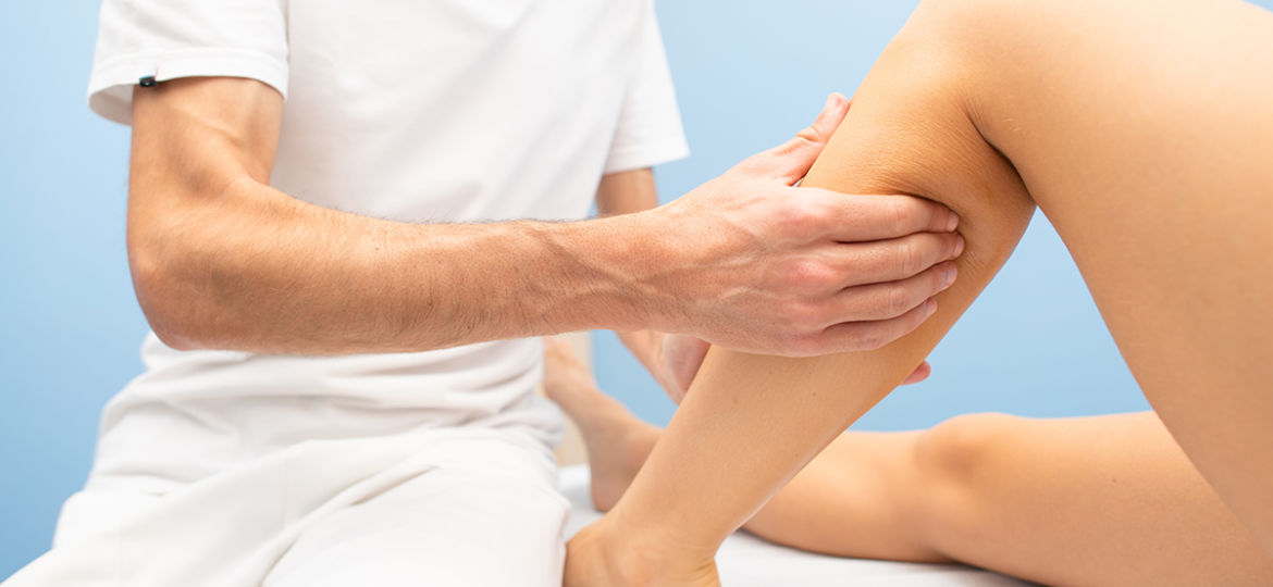 Delicate calf massage in a professional physiotherapist's studio